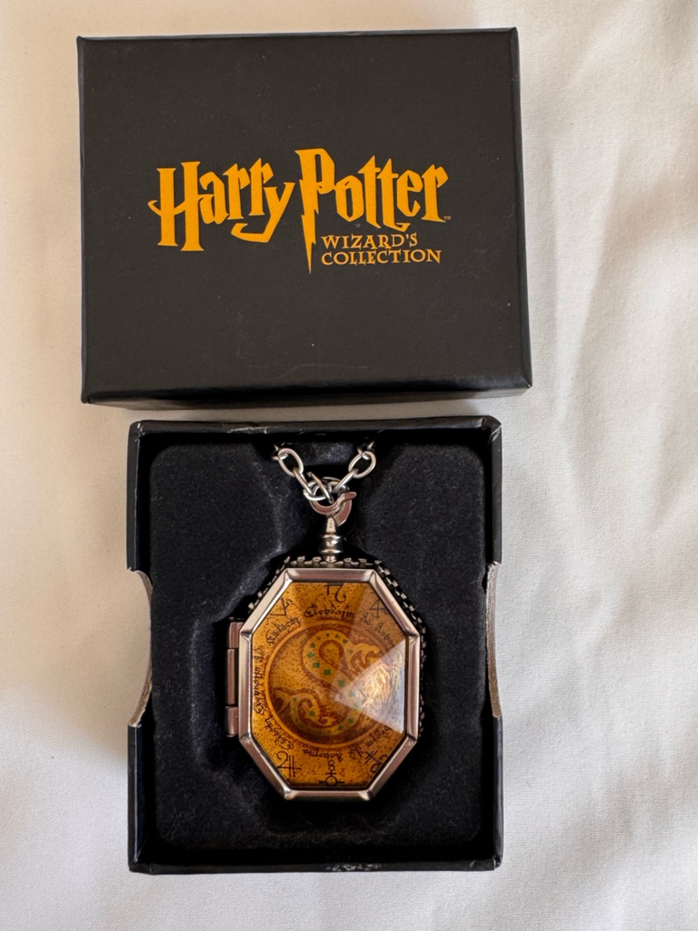 Warner Bros. Harry Potter Gold and Black Slytherin Locket Necklace